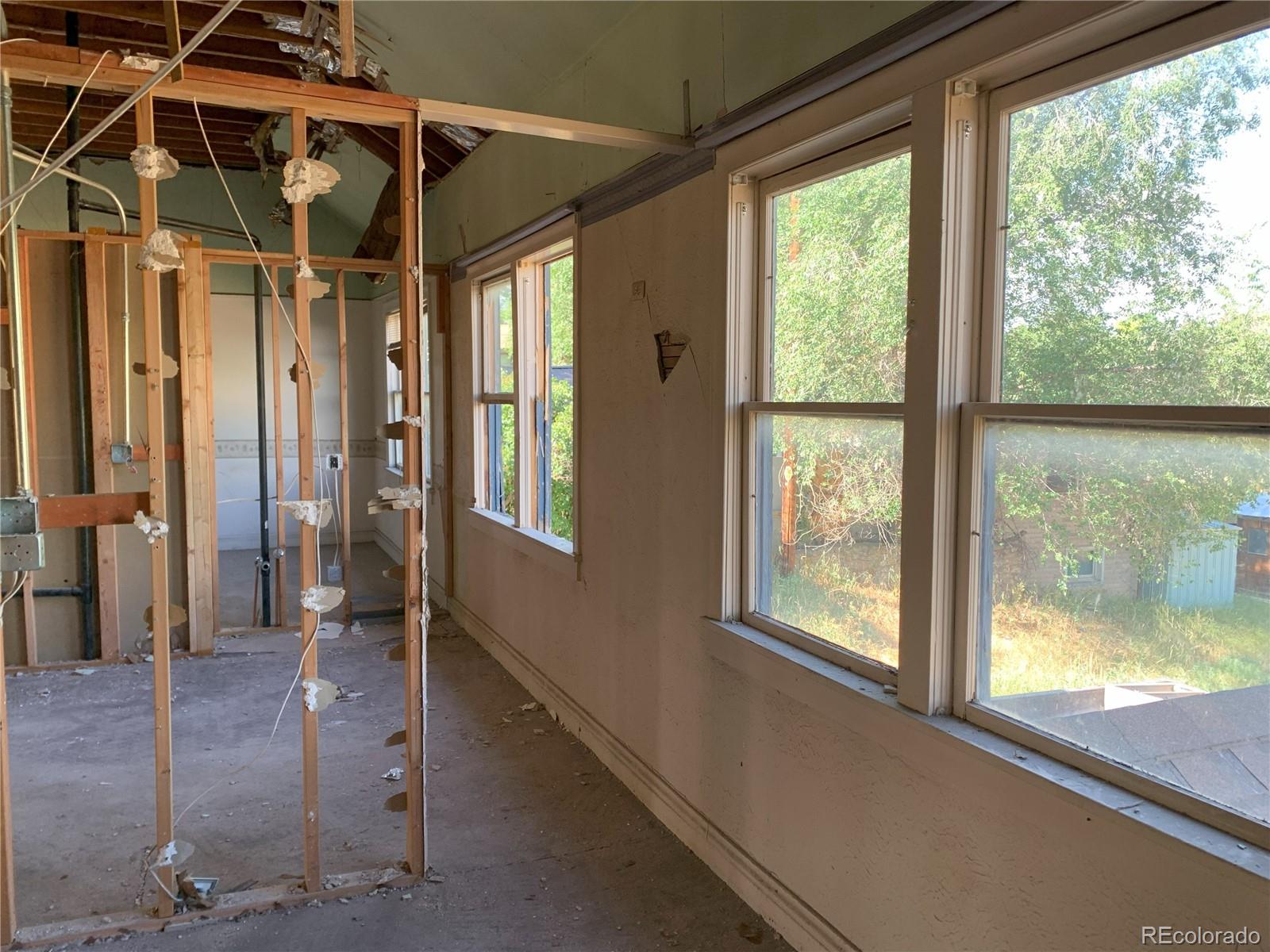527 West Avenue Rifle, CO 81650 - Photo 8 of 10 a view of a room with wooden floor and windows