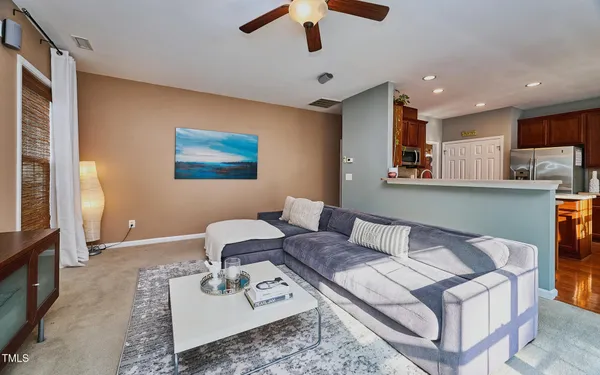 a living room with furniture and a rug
