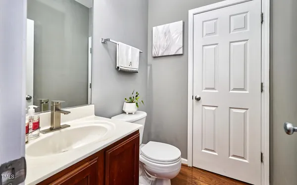 a bathroom with a sink toilet and vanity