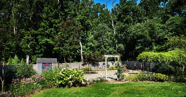 a view of a chair and table of the garden