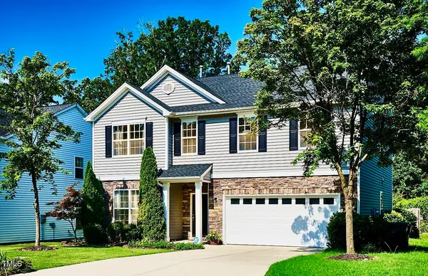 a house with a tree in front of it