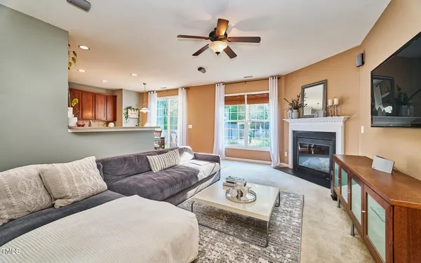 a living room with furniture fireplace and a flat screen tv