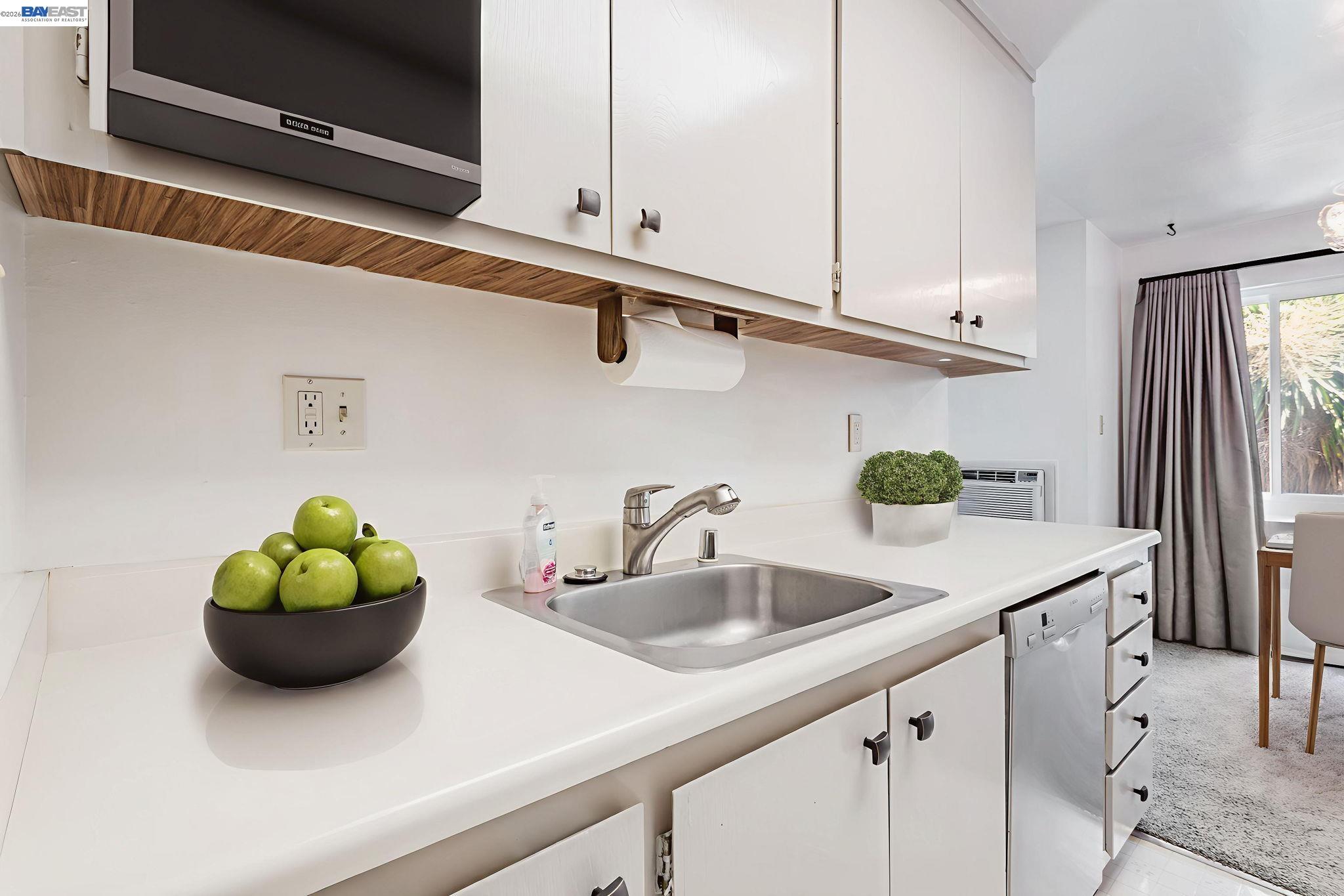 8975 Alcosta Boulevard, Unit 104 San Ramon, CA 94583 - Photo 5 of 42 This bright kitchen is waiting for your personal touch. This room is virtually staged