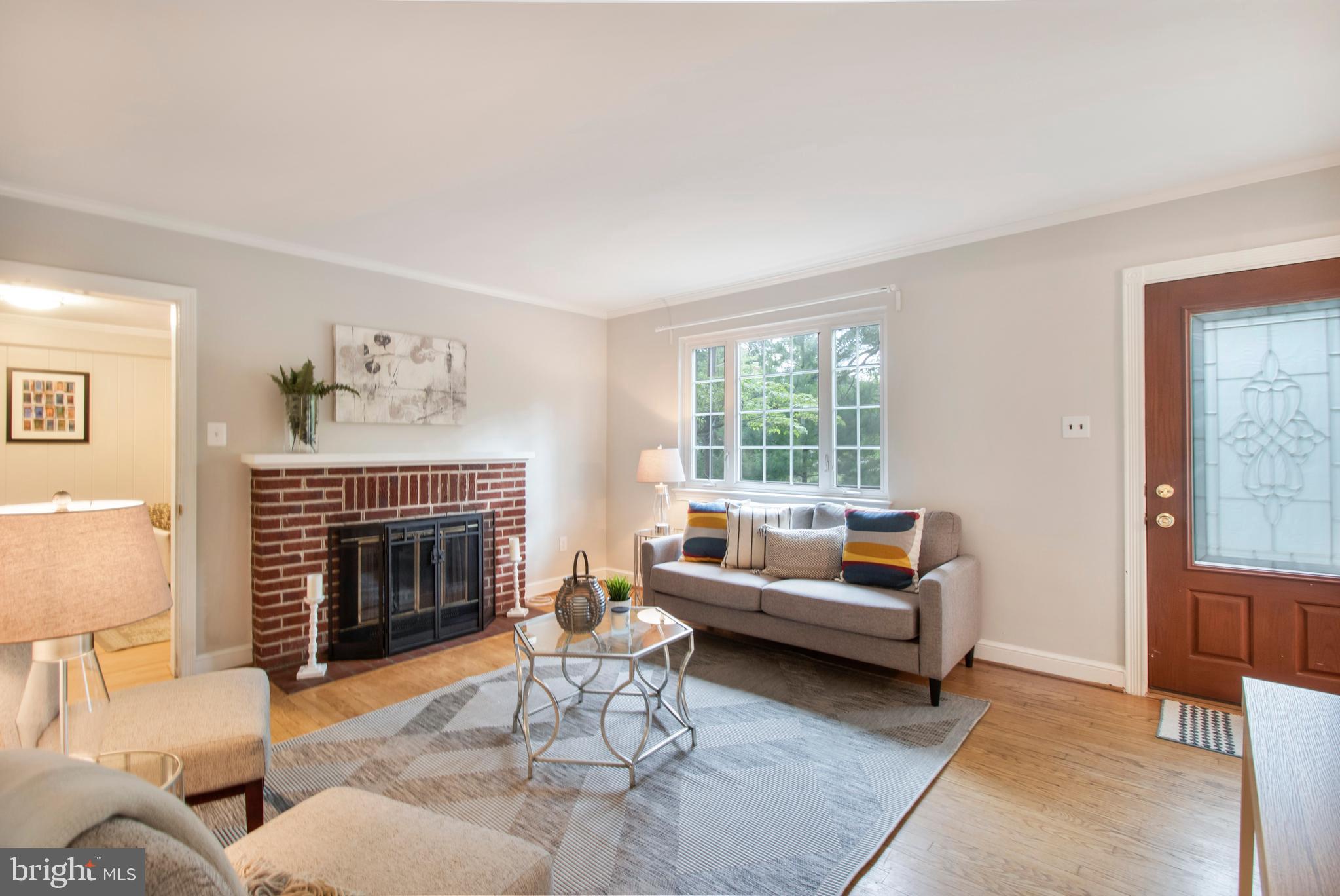 9013 Eton Road Silver Spring, MD 20901 - Photo 10 of 42 Inviting living-room w/ fireplace & picture window