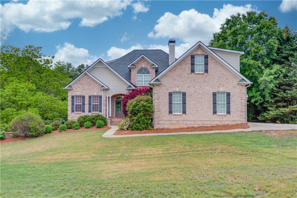 5667 Britt Whitmire Road Gainesville, GA 30506 - Photo 1 of 67 a front view of a house with garden