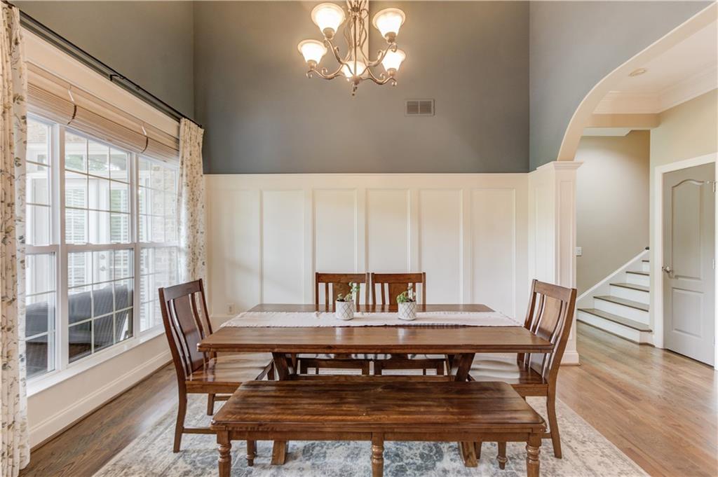 5667 Britt Whitmire Road Gainesville, GA 30506 - Photo 14 of 67 a view of a dining room with furniture and wooden floor