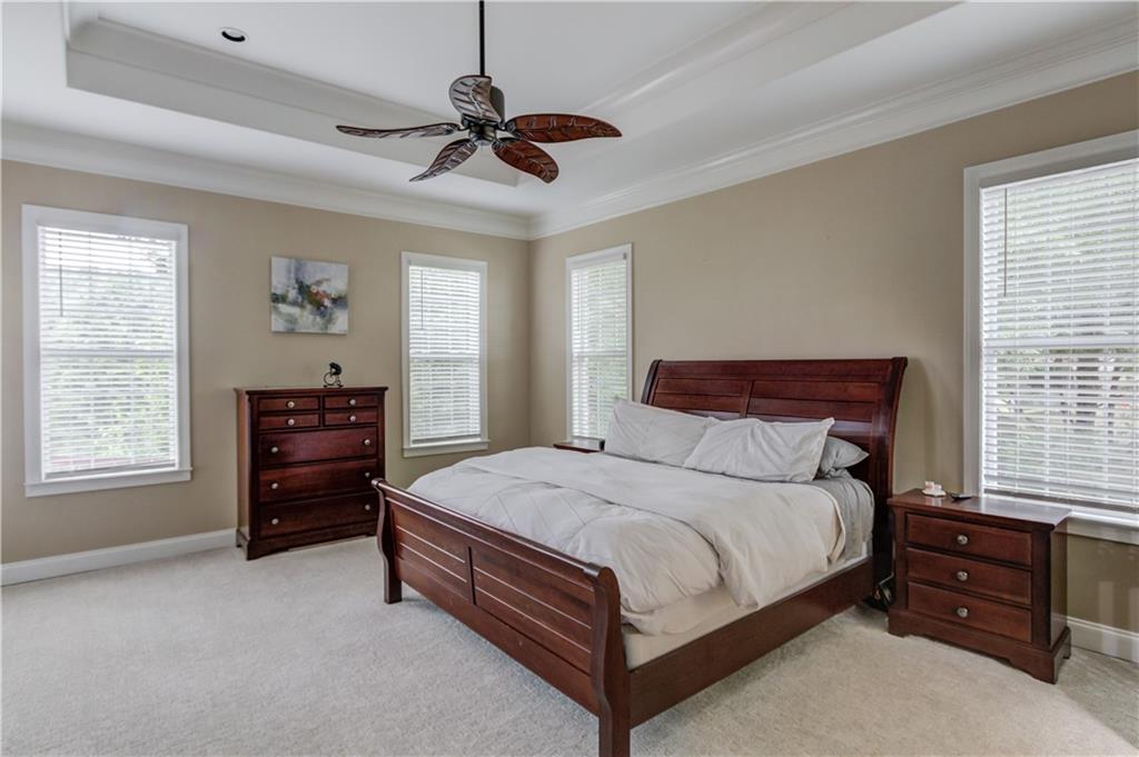 5667 Britt Whitmire Road Gainesville, GA 30506 - Photo 20 of 67 a bedroom with a bed and a dresser