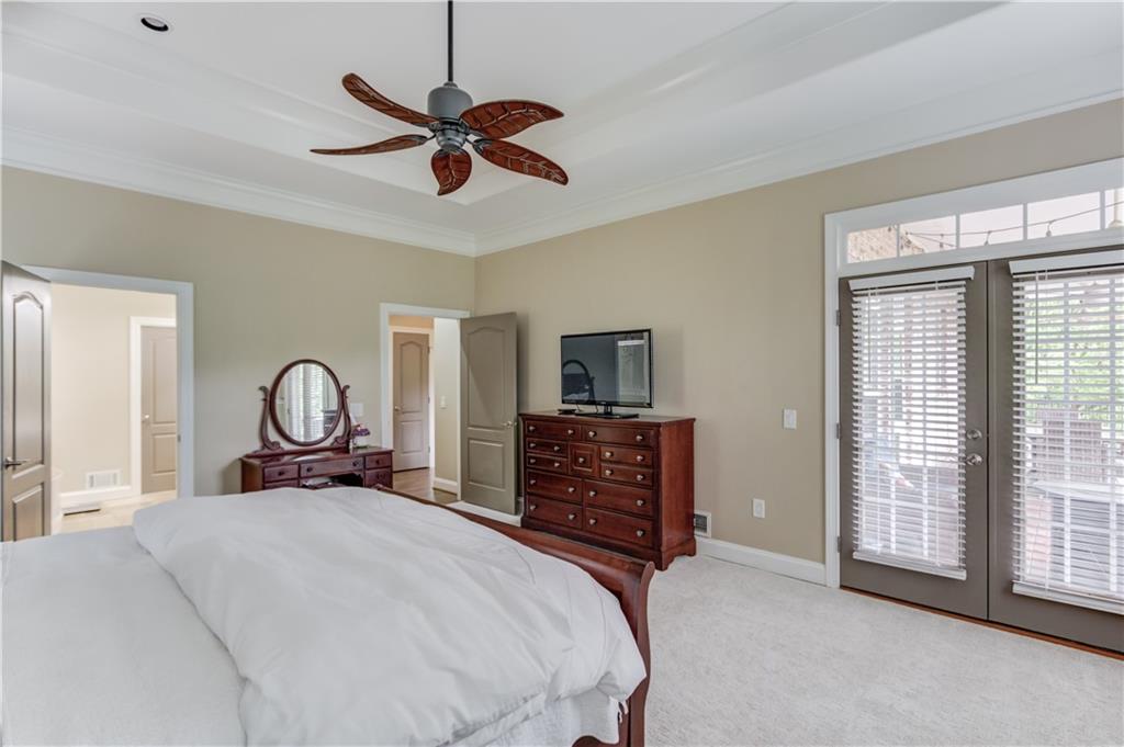 5667 Britt Whitmire Road Gainesville, GA 30506 - Photo 21 of 67 a bedroom with a bed and a large window