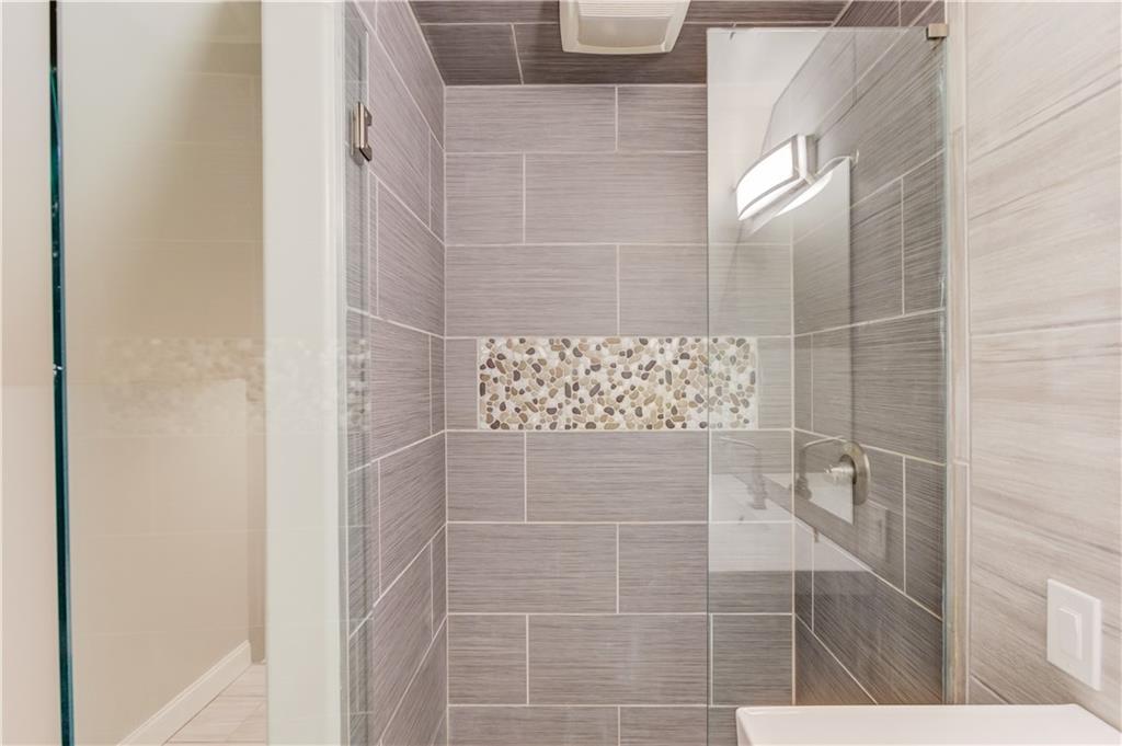 5667 Britt Whitmire Road Gainesville, GA 30506 - Photo 34 of 67 a bathroom with a shower
