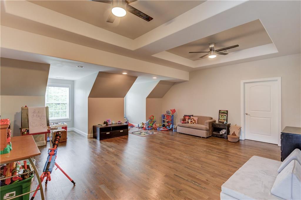 5667 Britt Whitmire Road Gainesville, GA 30506 - Photo 36 of 67 a living room with furniture and wooden floor
