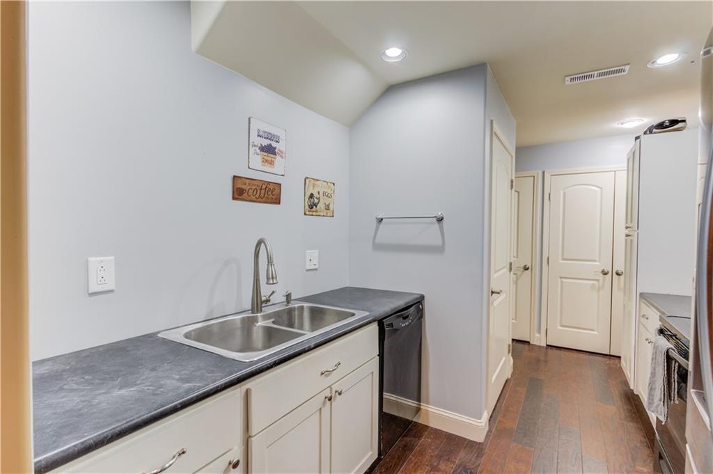 5667 Britt Whitmire Road Gainesville, GA 30506 - Photo 45 of 67 a kitchen with a sink and a refrigerator