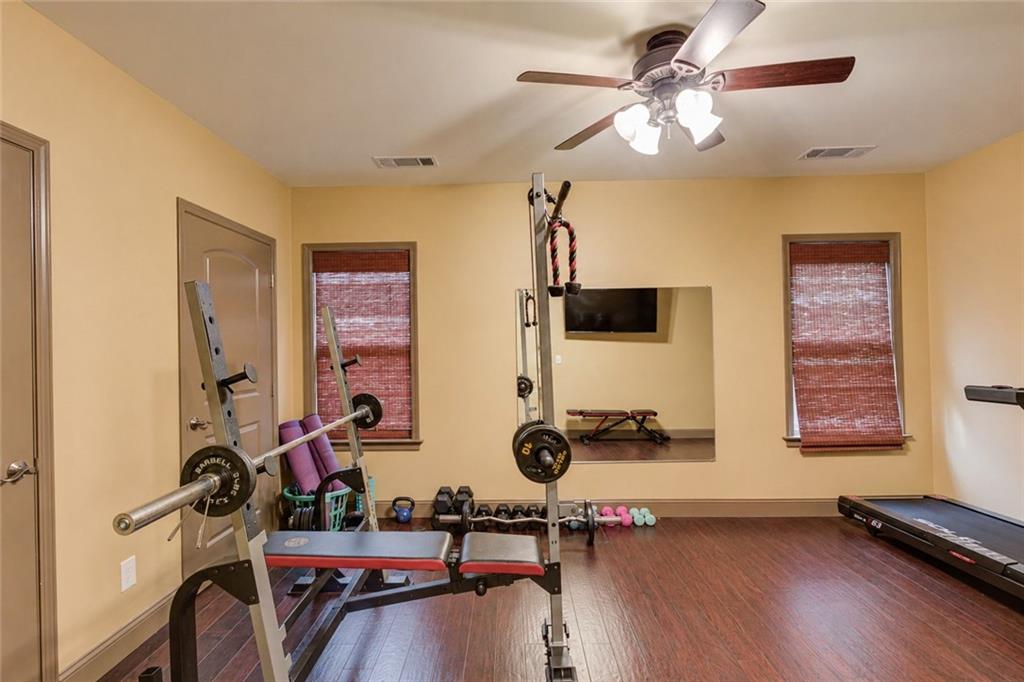 5667 Britt Whitmire Road Gainesville, GA 30506 - Photo 47 of 67 a view of a room with gym equipment