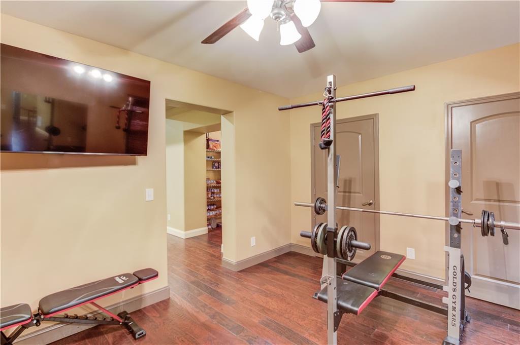 5667 Britt Whitmire Road Gainesville, GA 30506 - Photo 48 of 67 a view of a room with gym equipment