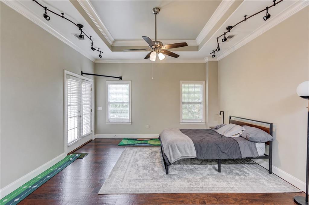 5667 Britt Whitmire Road Gainesville, GA 30506 - Photo 49 of 67 a bedroom with a bed chandelier and a window
