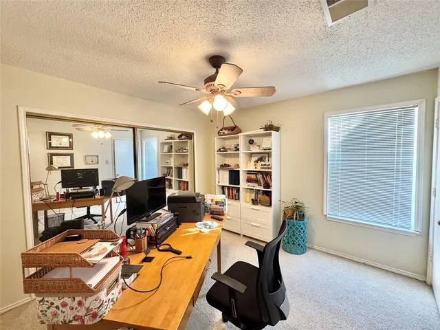 a view of a workspace with furniture
