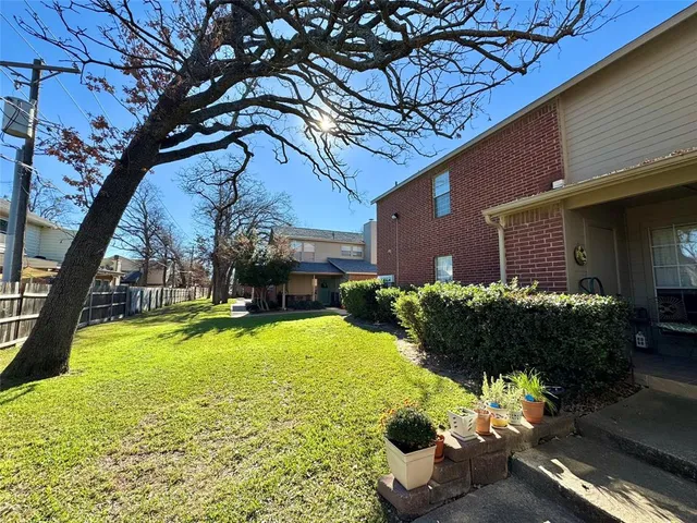 a front view of house with yard and outdoor seating