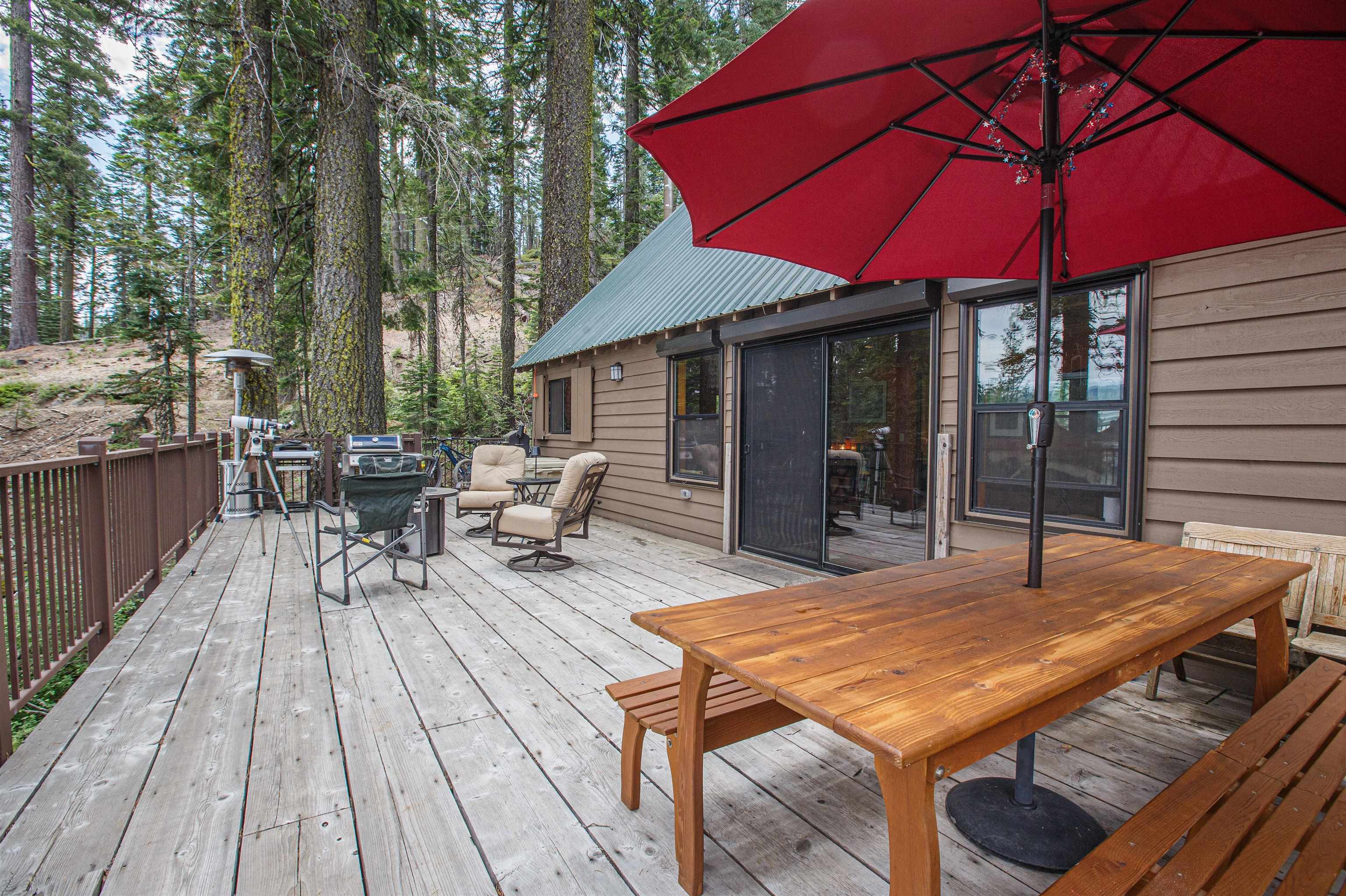 278 Mile High Road Quincy, CA 95971 - Photo 23 of 38 a view of a patio with table and chairs under an umbrella