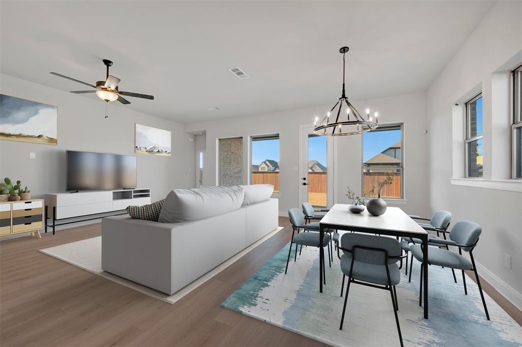 4022 Yellowstone Road Royse City, TX 75189 - Photo 11 of 20 a living room with furniture a chandelier and a table