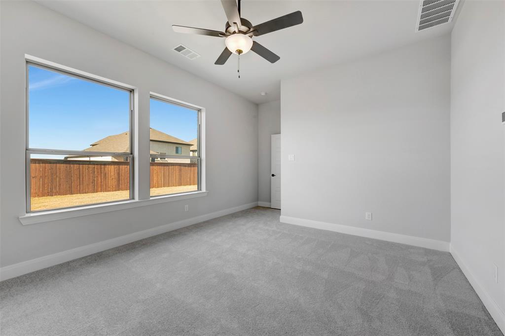 4022 Yellowstone Road Royse City, TX 75189 - Photo 14 of 20 an empty room with a window and a fan