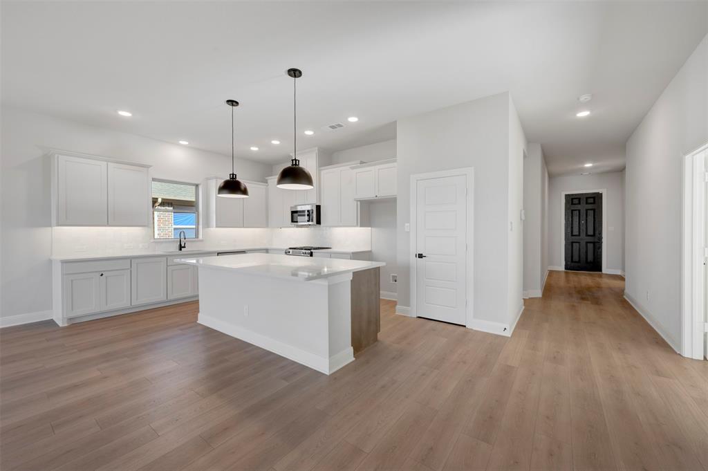 4022 Yellowstone Road Royse City, TX 75189 - Photo 8 of 20 a view of kitchen with wooden floor