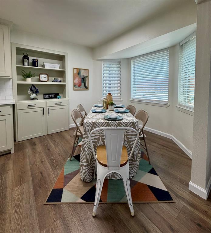 3609 Country Club Road Arlington, TX 76013 - Photo 15 of 40 a view of a dining room with furniture and wooden floor