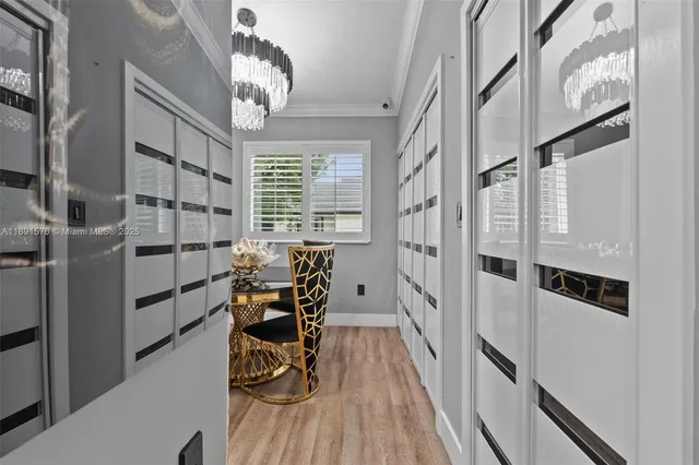 a view of a room with furniture and wooden floor