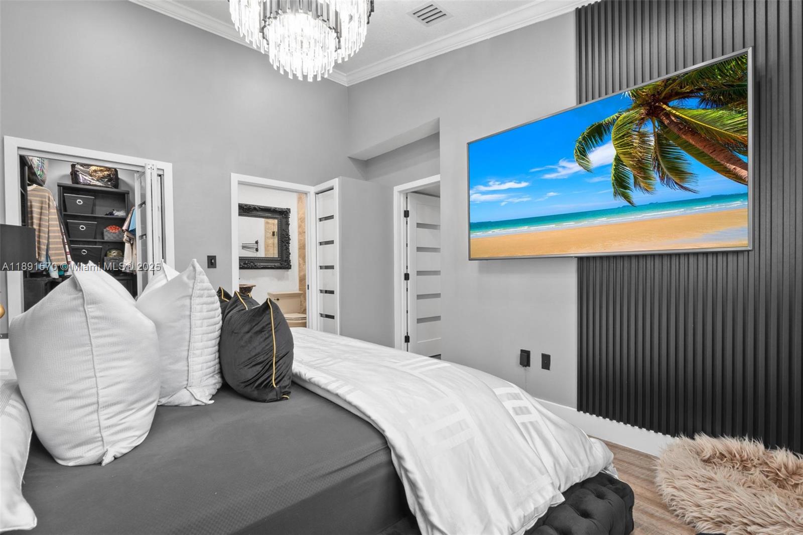 13160 Southwest 64th Terrace, Unit 1612 Miami, FL 33183 - Photo 14 of 32 a bedroom with a bed and a painting on the wall