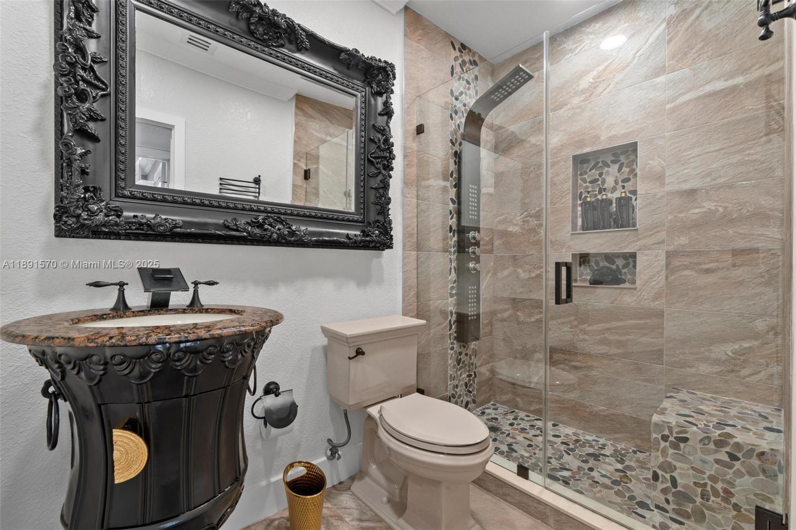 13160 Southwest 64th Terrace, Unit 1612 Miami, FL 33183 - Photo 19 of 32 a bathroom with a granite countertop toilet sink and mirror