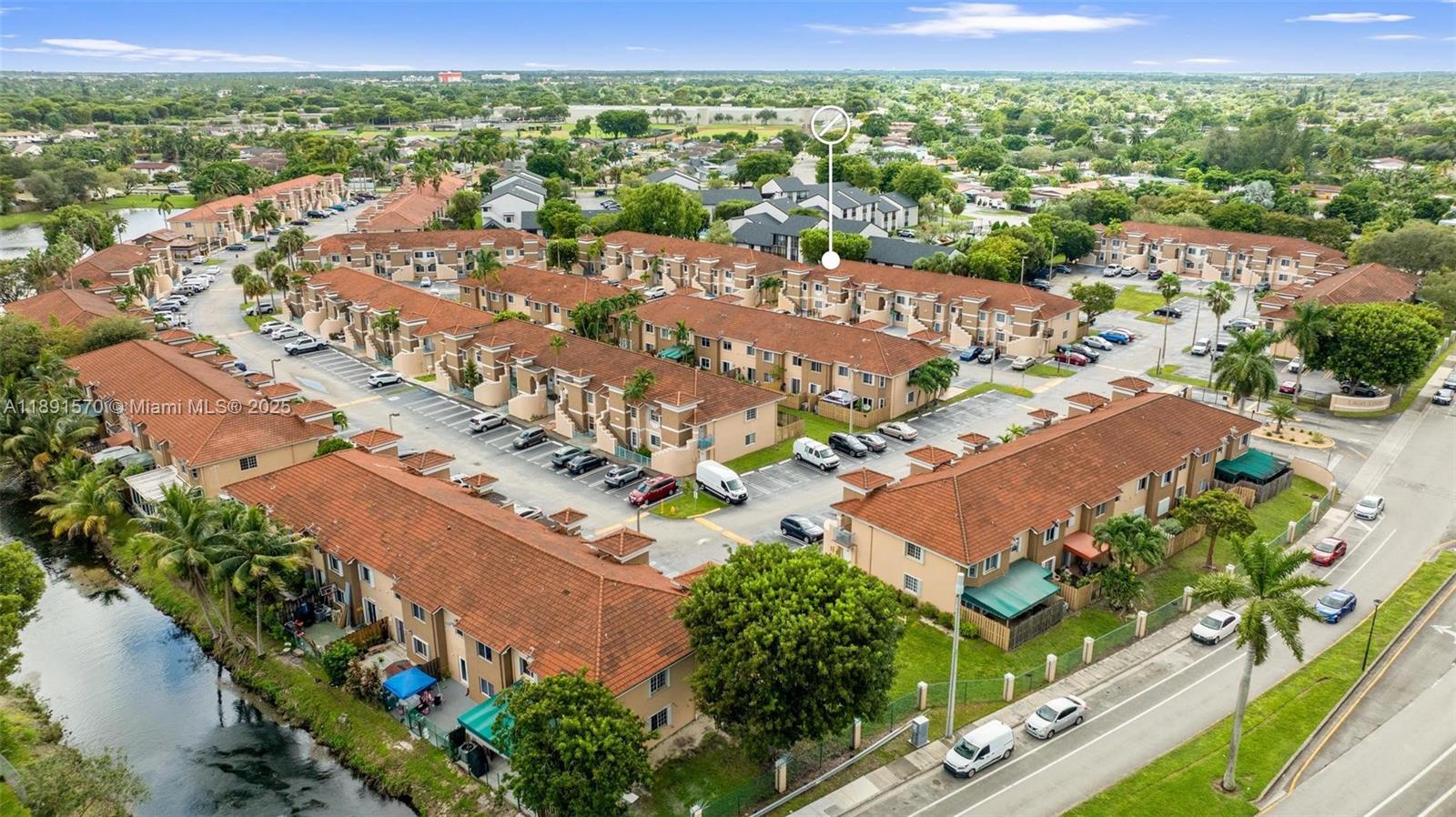 13160 Southwest 64th Terrace, Unit 1612 Miami, FL 33183 - Photo 27 of 32 an aerial view of residential houses with outdoor space