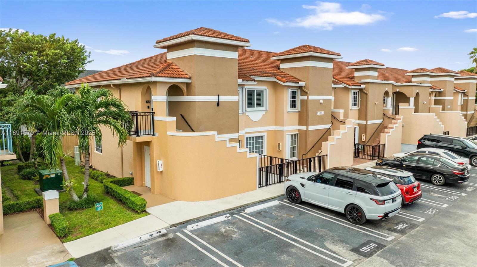 13160 Southwest 64th Terrace, Unit 1612 Miami, FL 33183 - Photo 31 of 32 a car parked in front of a white house