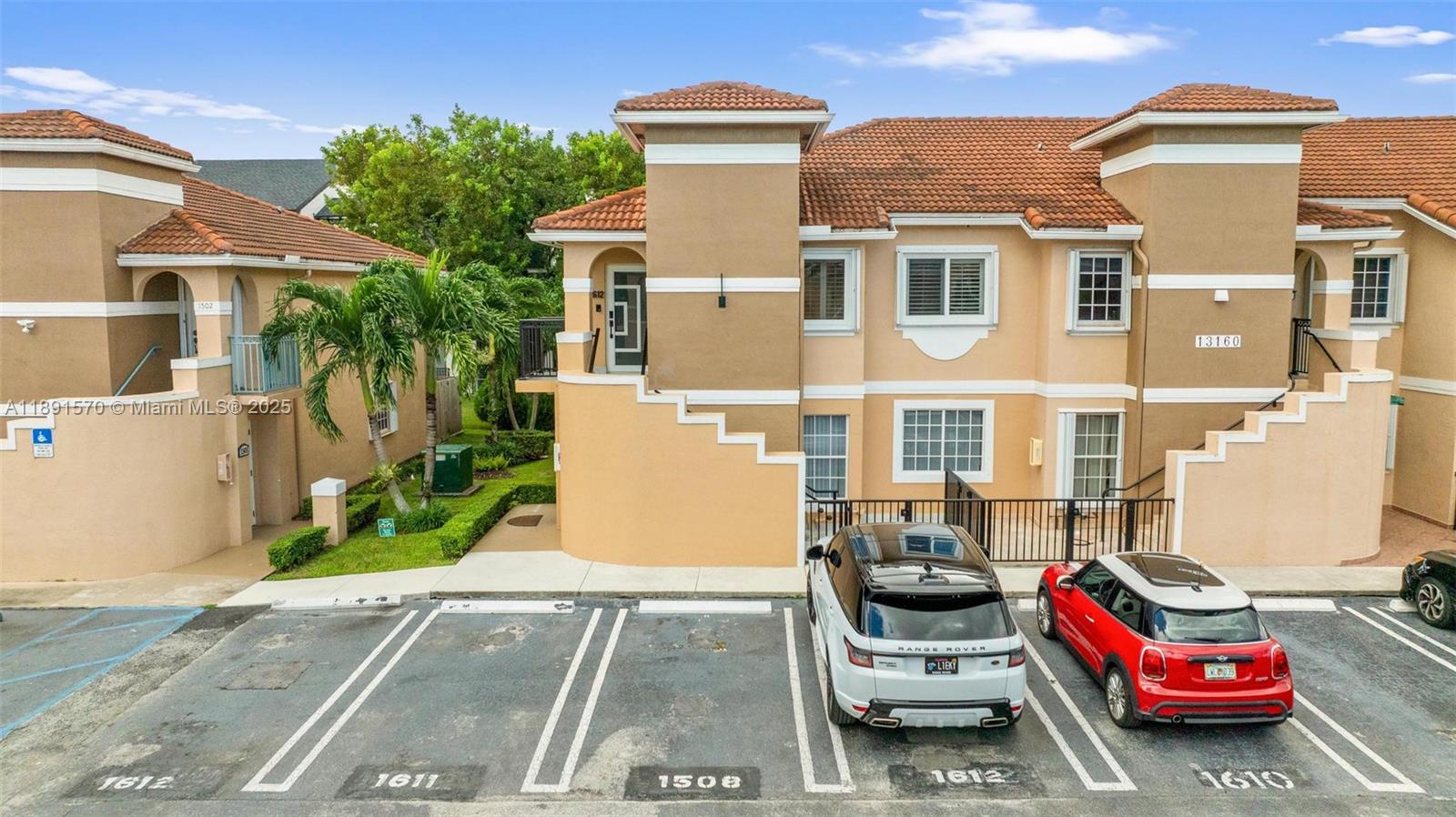 13160 Southwest 64th Terrace, Unit 1612 Miami, FL 33183 - Photo 32 of 32 a front view of a house with a garden