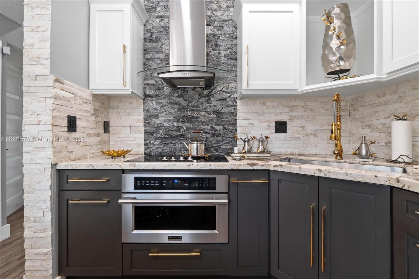 13160 Southwest 64th Terrace, Unit 1612 Miami, FL 33183 - Photo 5 of 32 a kitchen with a sink stove and cabinets
