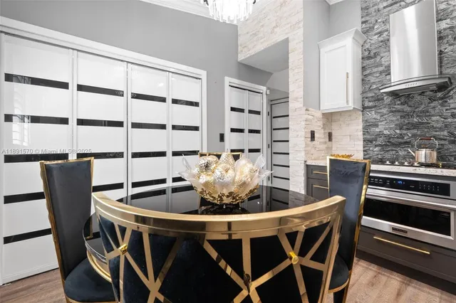 a dining room with furniture and window