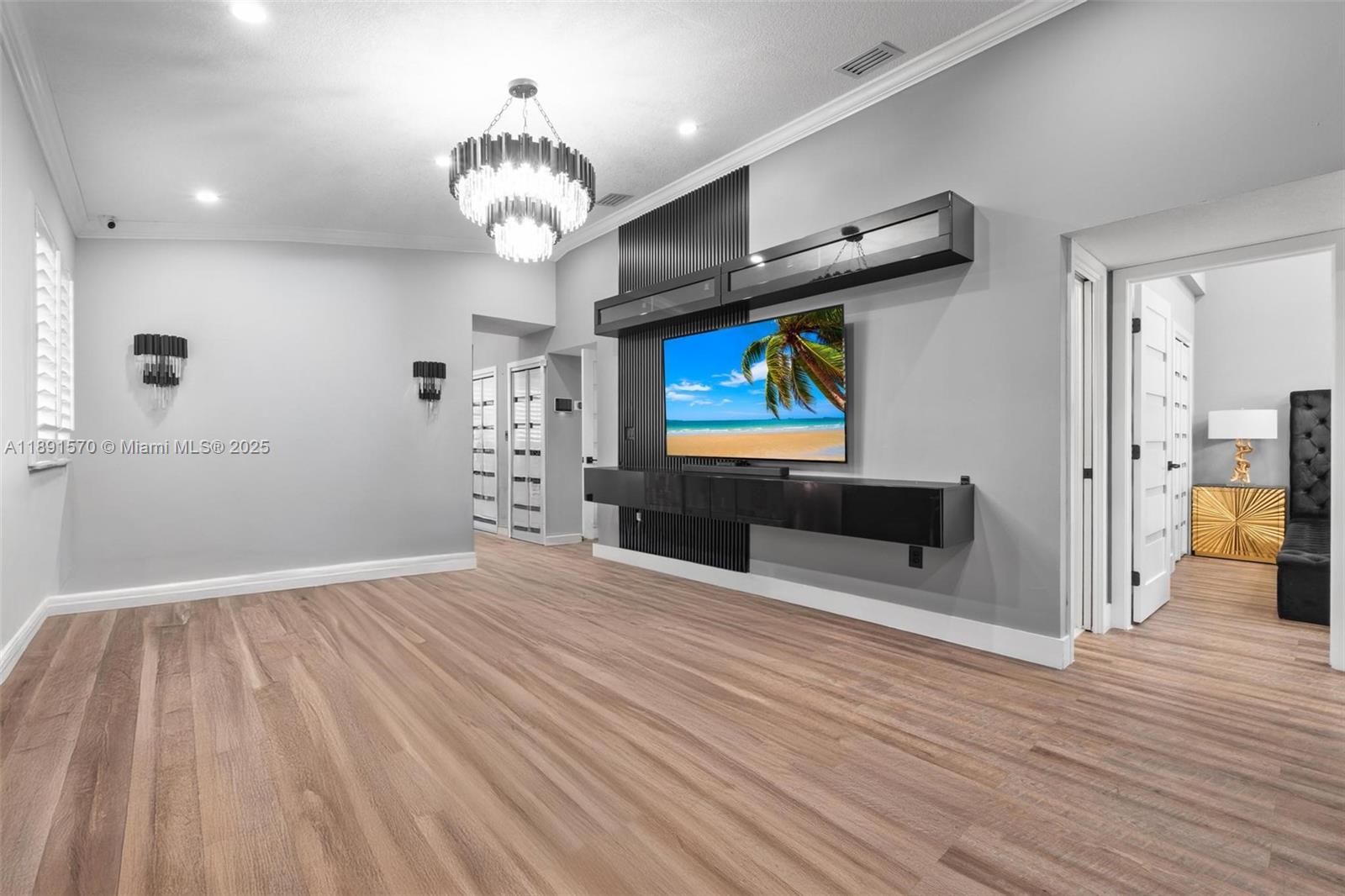 13160 Southwest 64th Terrace, Unit 1612 Miami, FL 33183 - Photo 10 of 32 a view of a livingroom with wooden floor and a ceiling fan