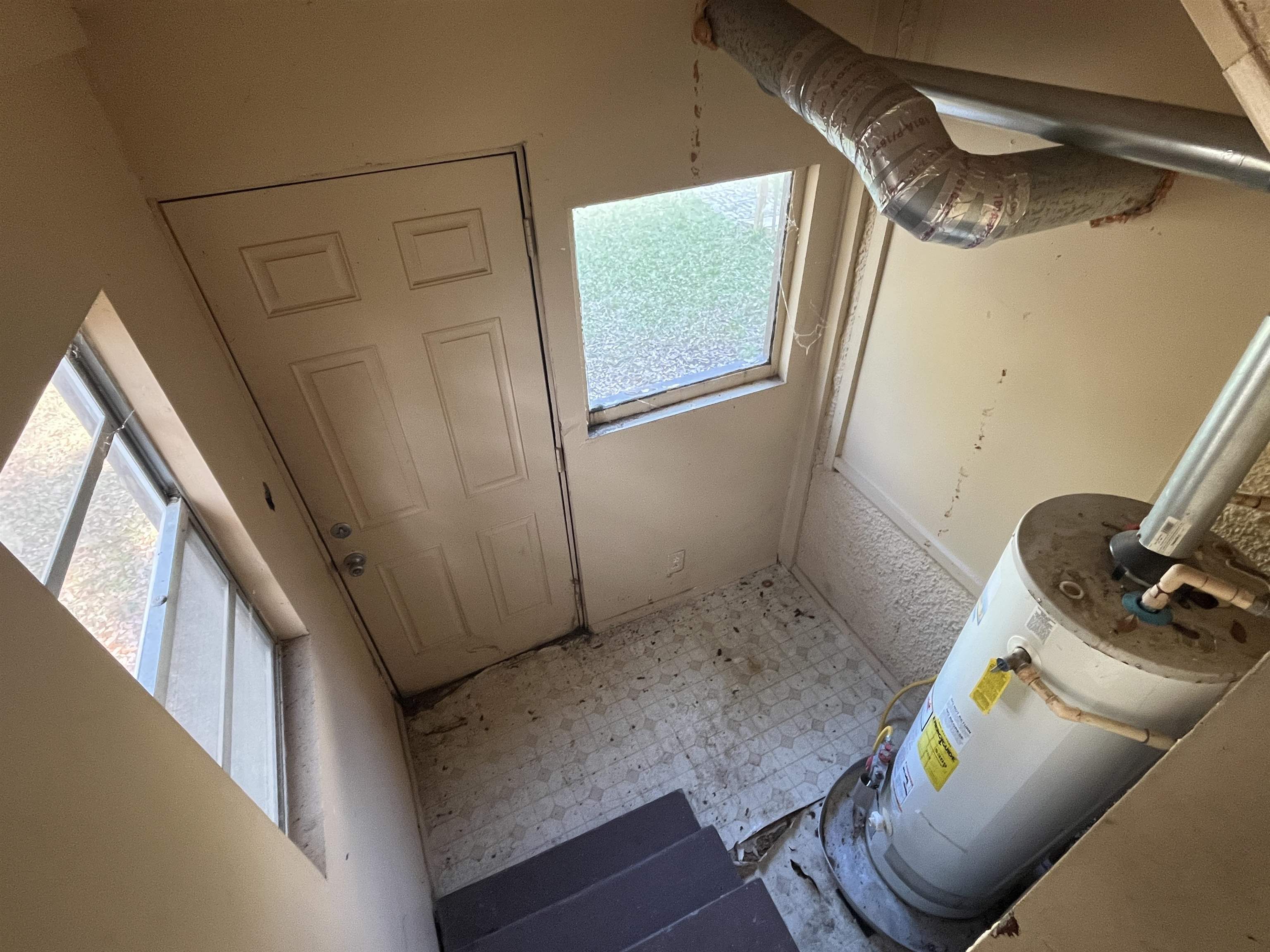211 4th Street Mobile, AL 36611 - Photo 22 of 34 Utility room featuring water heater
