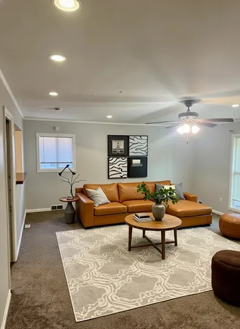 a living room with furniture and a rug