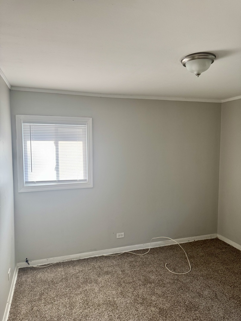 1212 East 151st Street Dolton, IL 60419 - Photo 5 of 24 an empty room with a workbench