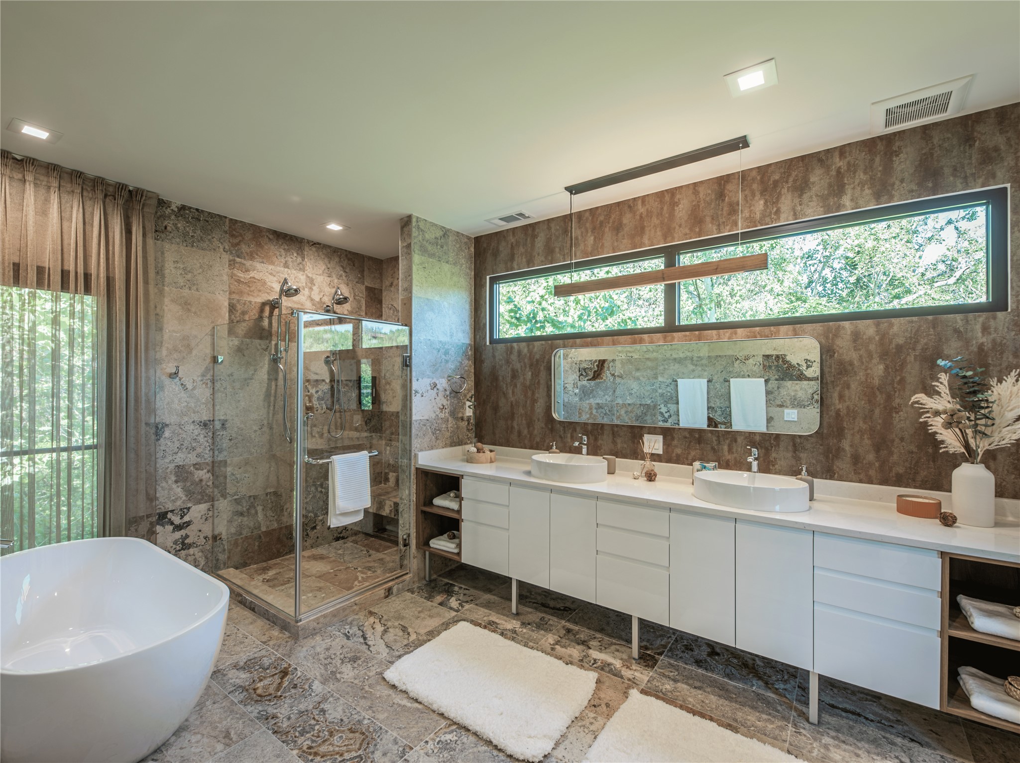 2806 Geronimo Trail Austin, TX 78734 - Photo 13 of 36 a bathroom with a double vanity sink toilet mirror and bathtub