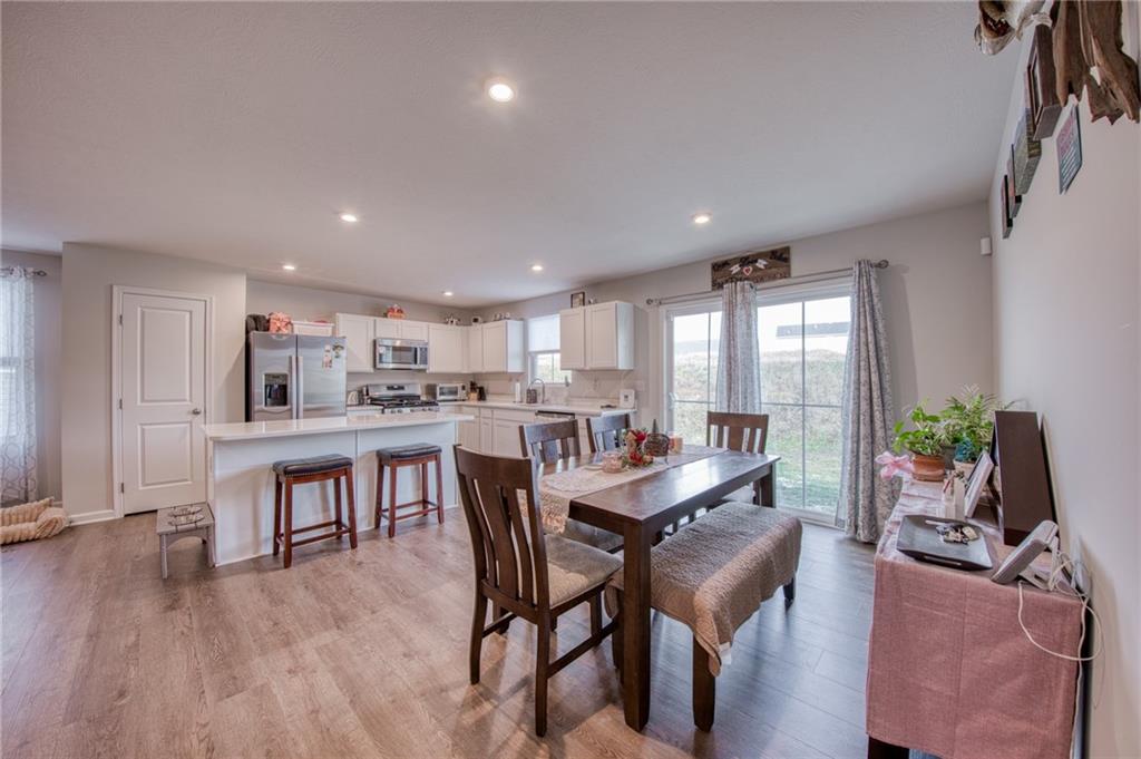 113 Dominic Drive Butler, PA 16001 - Photo 12 of 45 a view of a dining room with furniture window and wooden floor