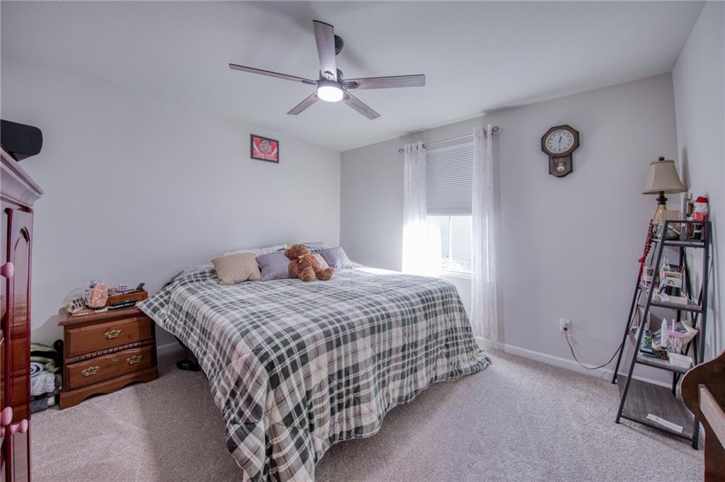 113 Dominic Drive Butler, PA 16001 - Photo 18 of 45 a bedroom with a bed and a chandelier