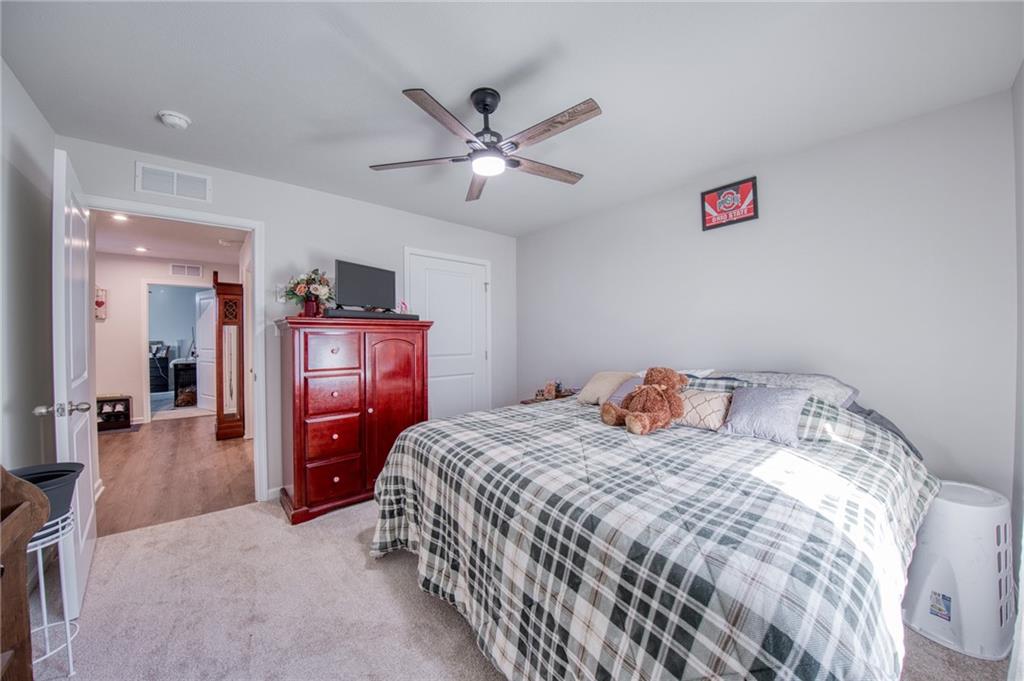 113 Dominic Drive Butler, PA 16001 - Photo 20 of 45 a bedroom with a bed and a chandelier