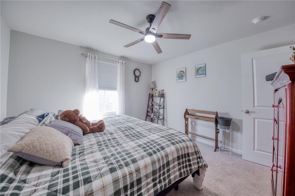 113 Dominic Drive Butler, PA 16001 - Photo 21 of 45 a bedroom with a bed and a ceiling fan