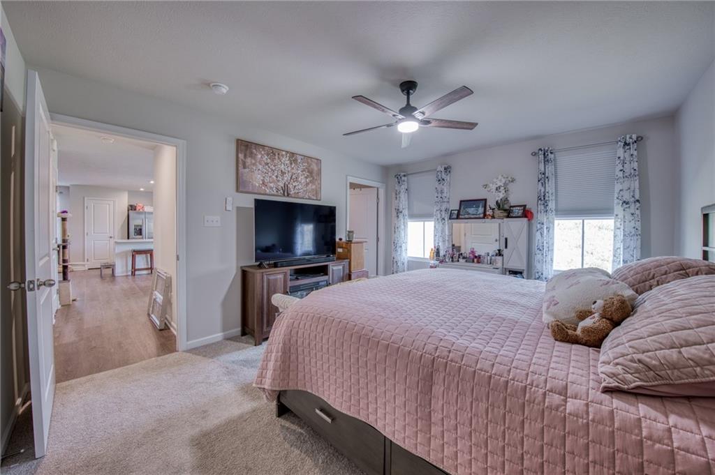 113 Dominic Drive Butler, PA 16001 - Photo 23 of 45 a bedroom with a bed and a flat screen tv