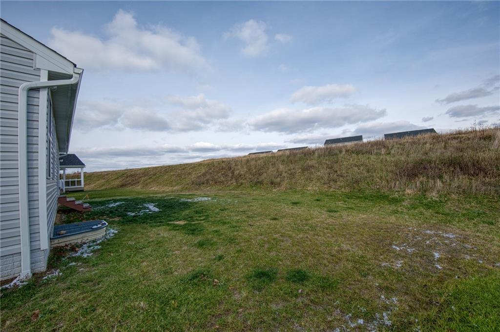 113 Dominic Drive Butler, PA 16001 - Photo 38 of 45 a view of a green field with lots of trees in the background