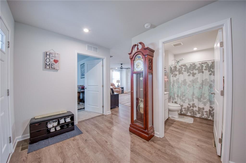 113 Dominic Drive Butler, PA 16001 - Photo 7 of 45 a view of a hallway with wooden floor and a living room