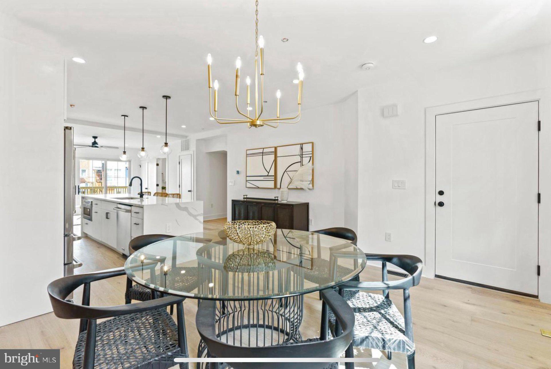 625 Quebec Place Northwest, Unit 1 Washington, DC 20010 - Photo 7 of 20 a view of a dining room with furniture and wooden floor