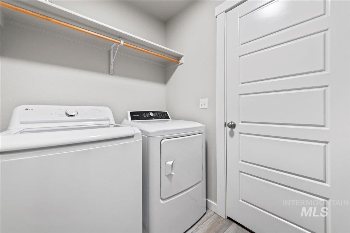 2471 East Goldstone Street Meridian, ID 83642 - Photo 25 of 27 Laundry room with independent washer and dryer and light wood finished floors