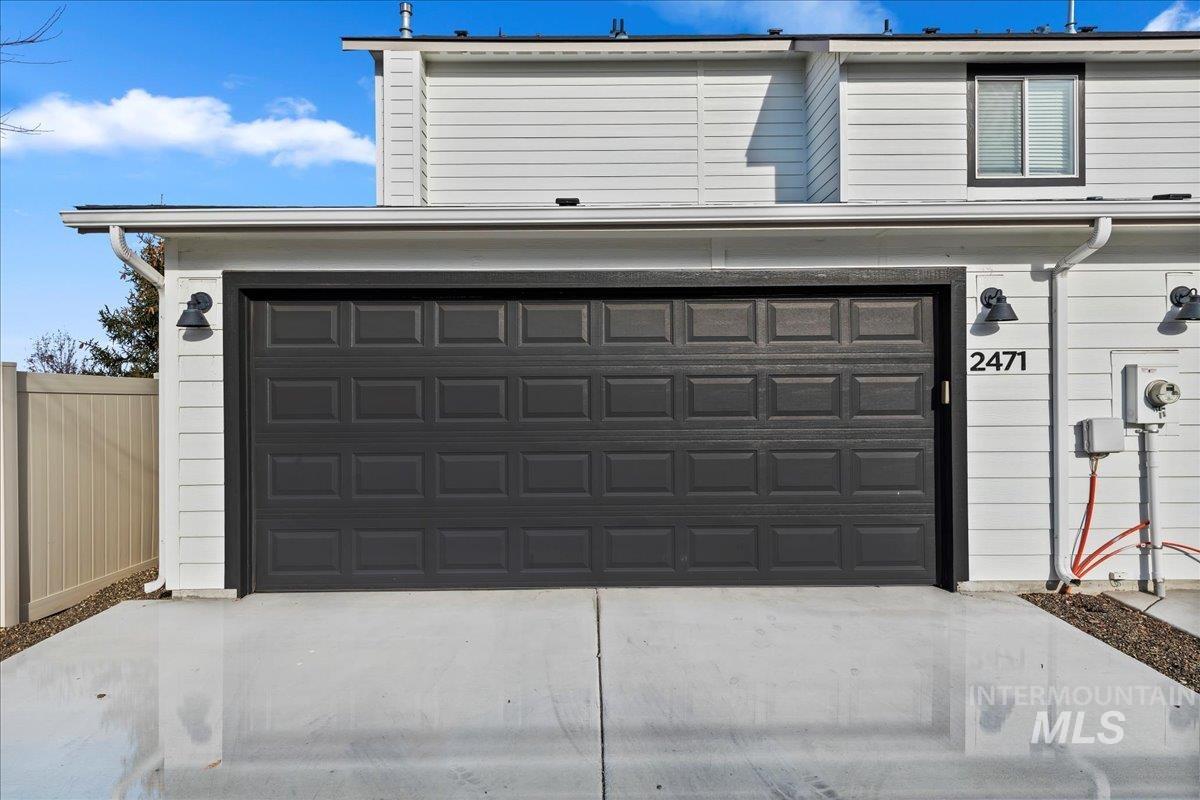 2471 East Goldstone Street Meridian, ID 83642 - Photo 26 of 27 Garage featuring concrete driveway