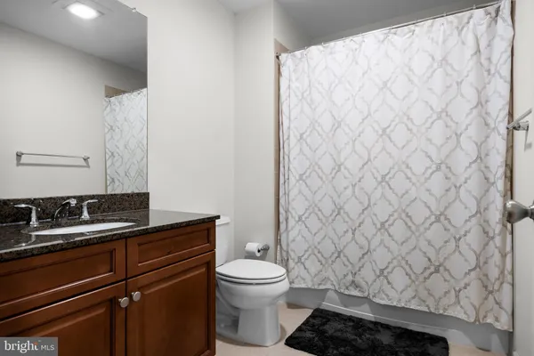 a bathroom with a toilet and a sink