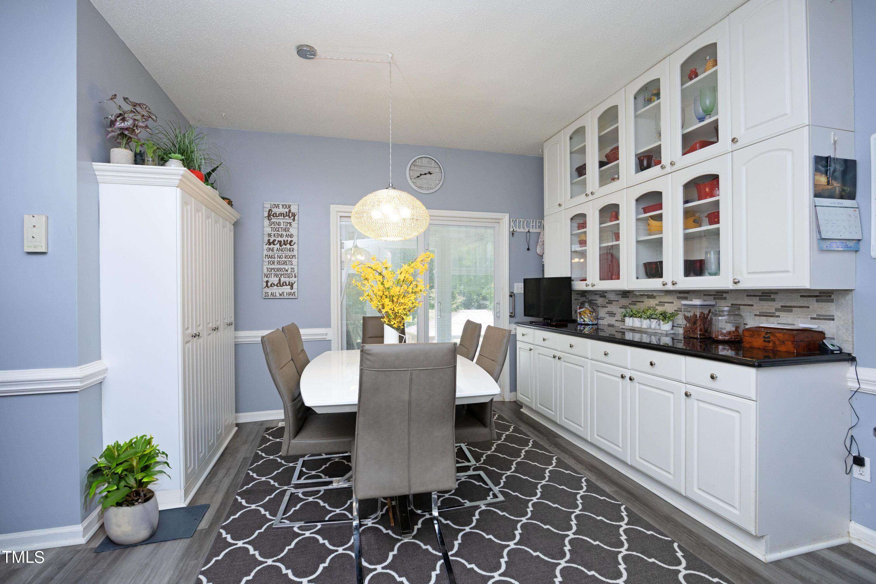 243 Bradley Drive Benson, NC 27504 - Photo 11 of 43 a living room with granite countertop furniture and a potted plant